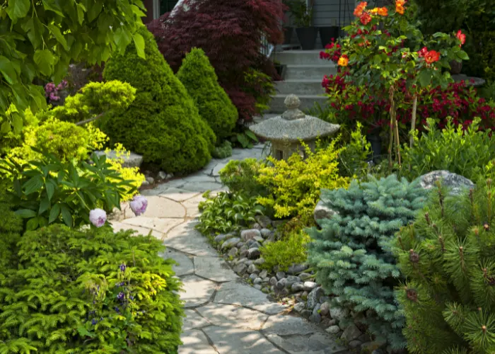 A stone path through a beautiful garden